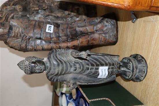 Two Indian wood carvings and a bronze figure of Buddha